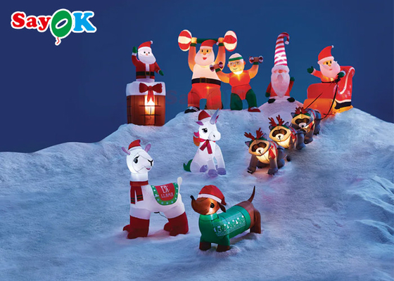 Gigantyczne świąteczne nadmuchiwane ozdoby świąteczne Trzy szopy szopy ciągną Świętego Mikołaja, aby dawać prezenty